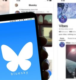 A phone with the Bluesky logo on the screen