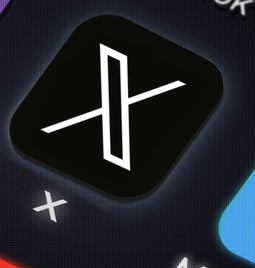 X app logo on a phone screen, with other social apps surrounding it