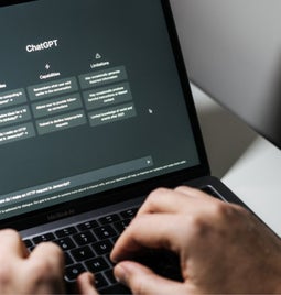 Laptop screen showing ChatGPT homepage