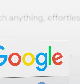 Close-up of Google logo on a white background with the text 
