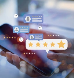 Floating images of reviews and star ratings above a mobile phone