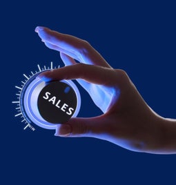 woman's hand cracking up a dial that says 