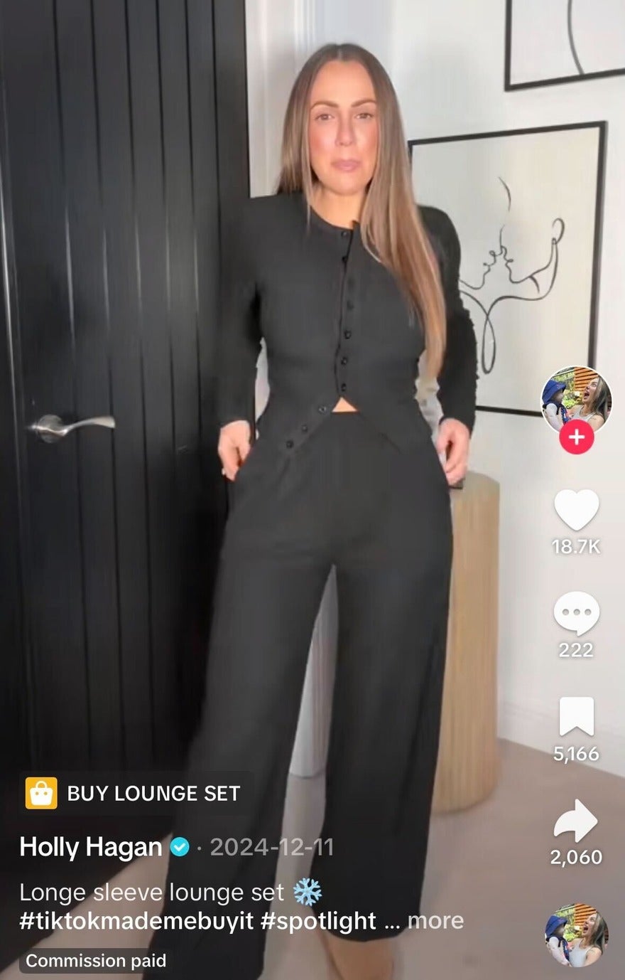 Person modelling black trousers and long sleeve button up top with a TikTok Shop link attached