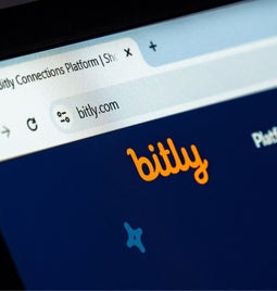 Closeup of the Bitly logo on a website header