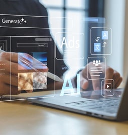 A person's hands using a computer with a graphic overlay that says 