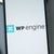 Closeup of a phone with the WP Engine logo on the screen