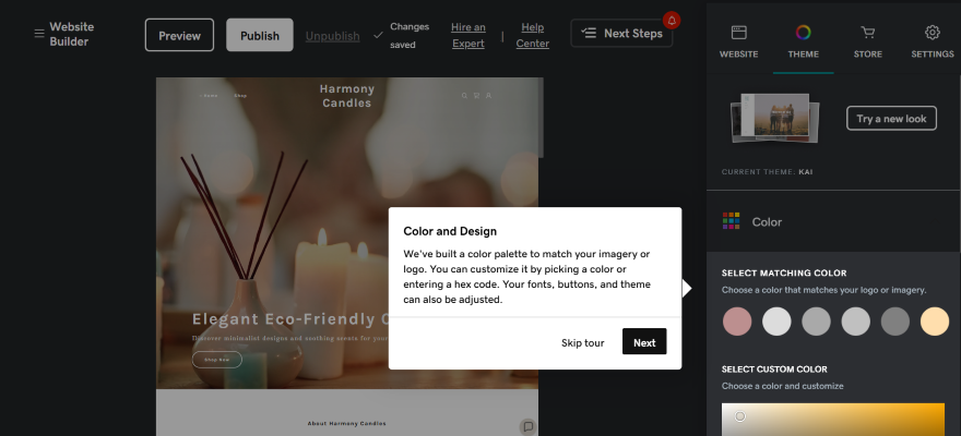 The GoDaddy editor with an onboarding pop-up showing how to change colours