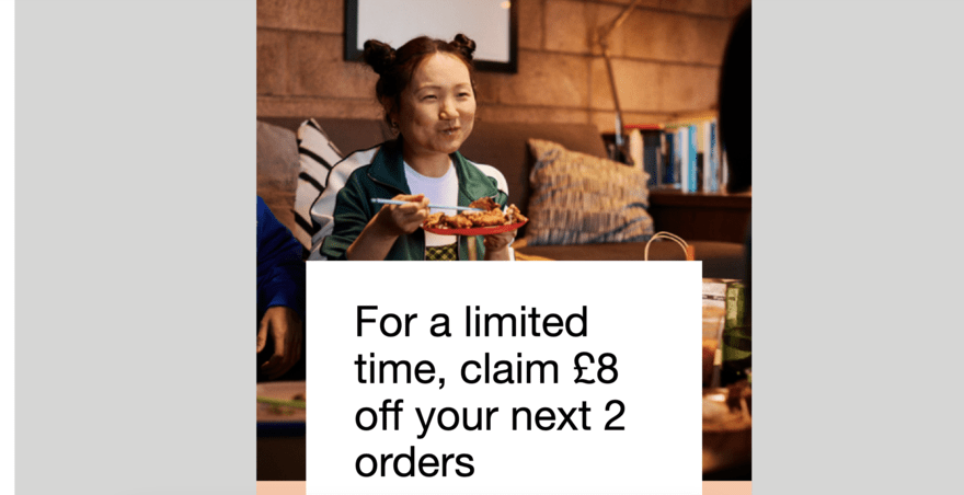 Ad from Uber Eats featuring a woman eating food with a white text box that says "For a limited time, claim &pound;8 off your next 2 orders"